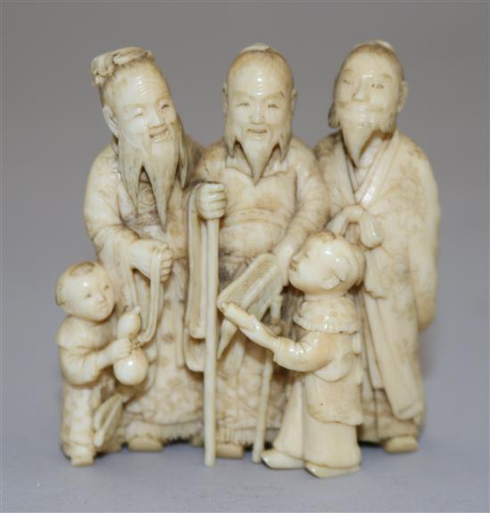A Japanese ivory okimono of three sages and two attendant children, Meiji period, height 5.9cm